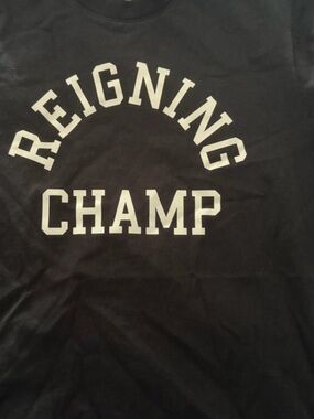 Reigning Champ Black Short Sleeve Logo Tee with White Arch Print.